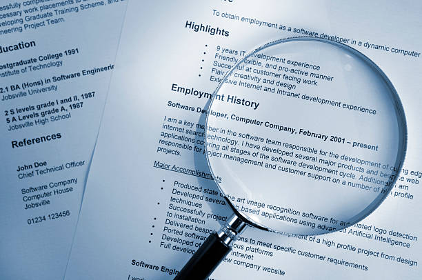 Magnifying Glass on Resume stock photo