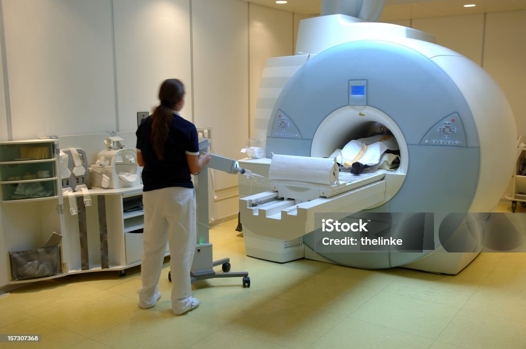 Worker using the magnetic resonance imaging scan Magnetic resonance imaging scan in a german hospital PET Scan Machine Stock Photo