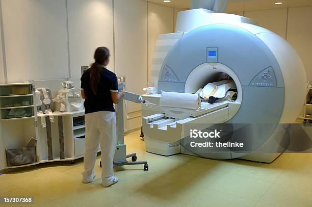 Worker Using The Magnetic Resonance Imaging Scan Stock Photo - Download Image Now - PET Scan Machine, Cancer - Illness, Machinery