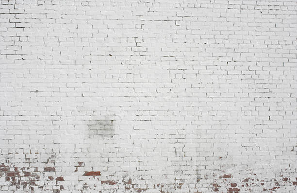 old pintó fondo de pared de ladrillo blanco patrón de diseño - paint peel peeling white fotografías e imágenes de stock