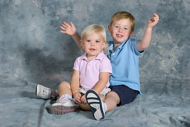 Brother and Sister Portrait Sitting stock photo