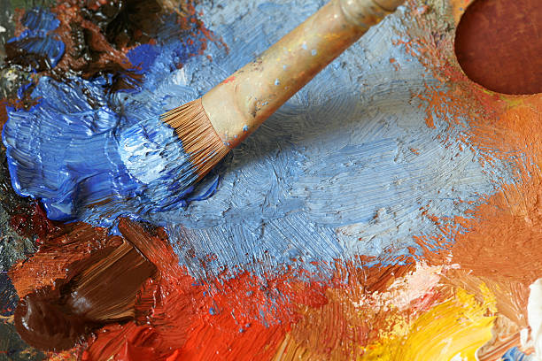 istock Paintbrush with oil paint on a classical palette - XL 157307514