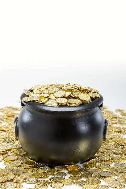 This is a photograph of a bucket of Gold on grass for St. Patrick's day. There is a lot of space for copy.