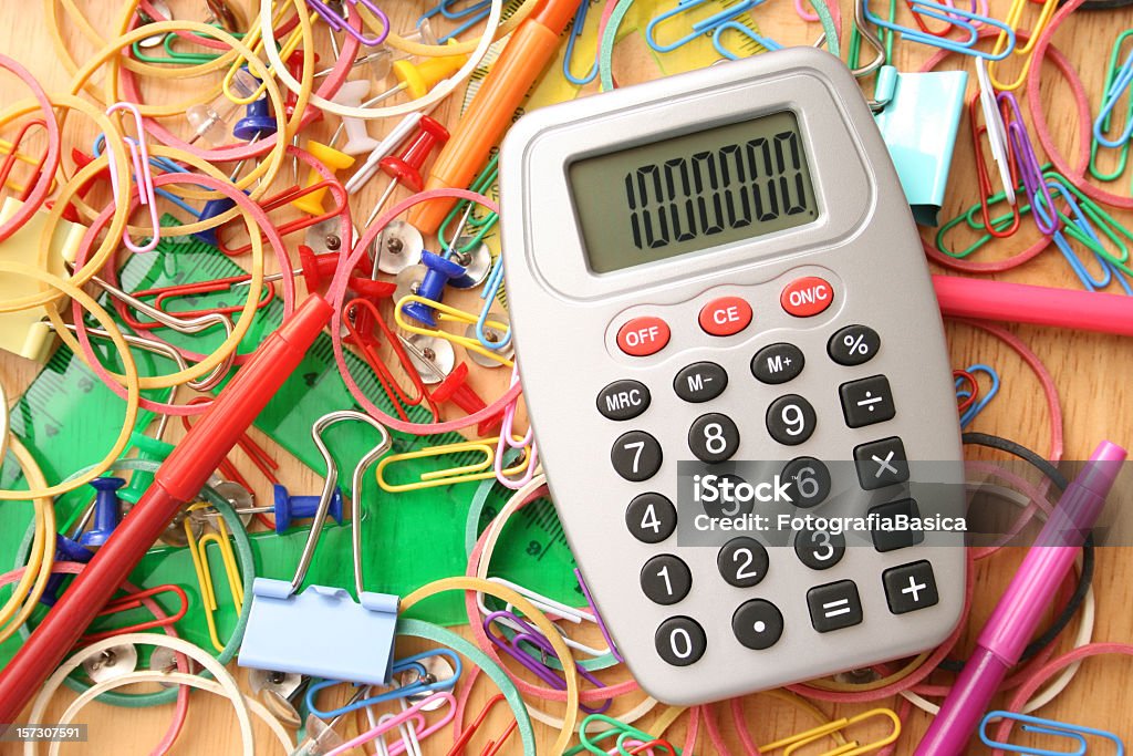 Messy desk Calculator over messy desk Cluttered Stock Photo