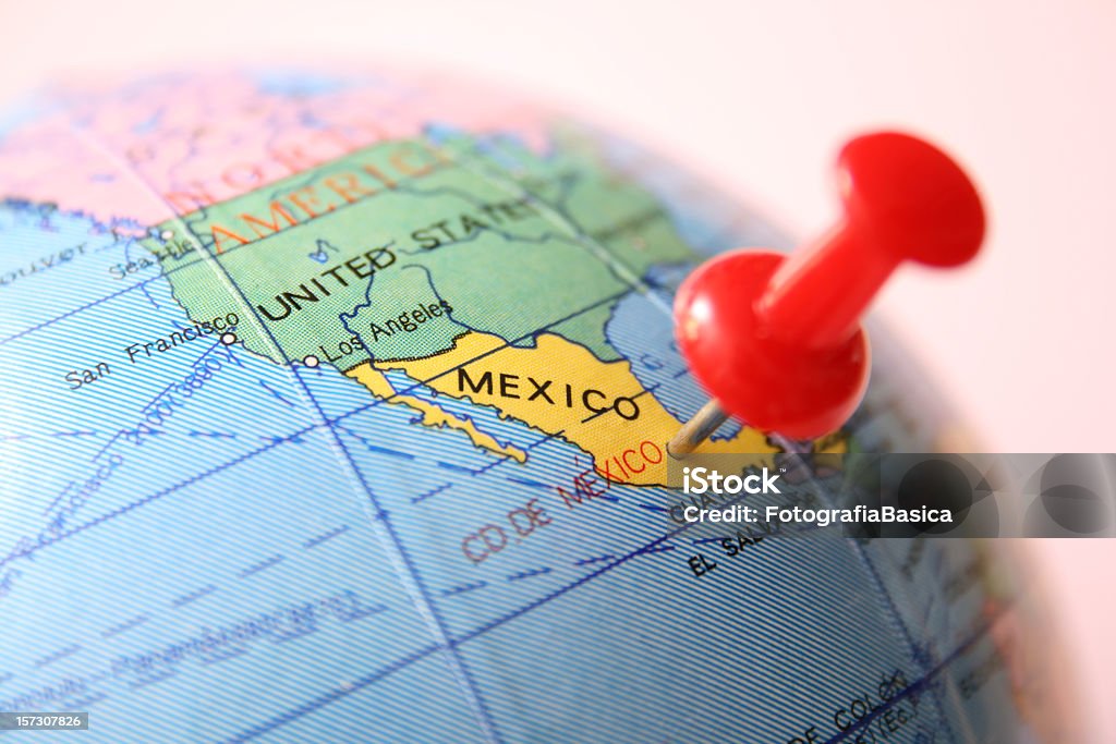 Mexico Pushpin pointing Mexico City in cheap plastic globe. Shallow depth of field Mexico Stock Photo