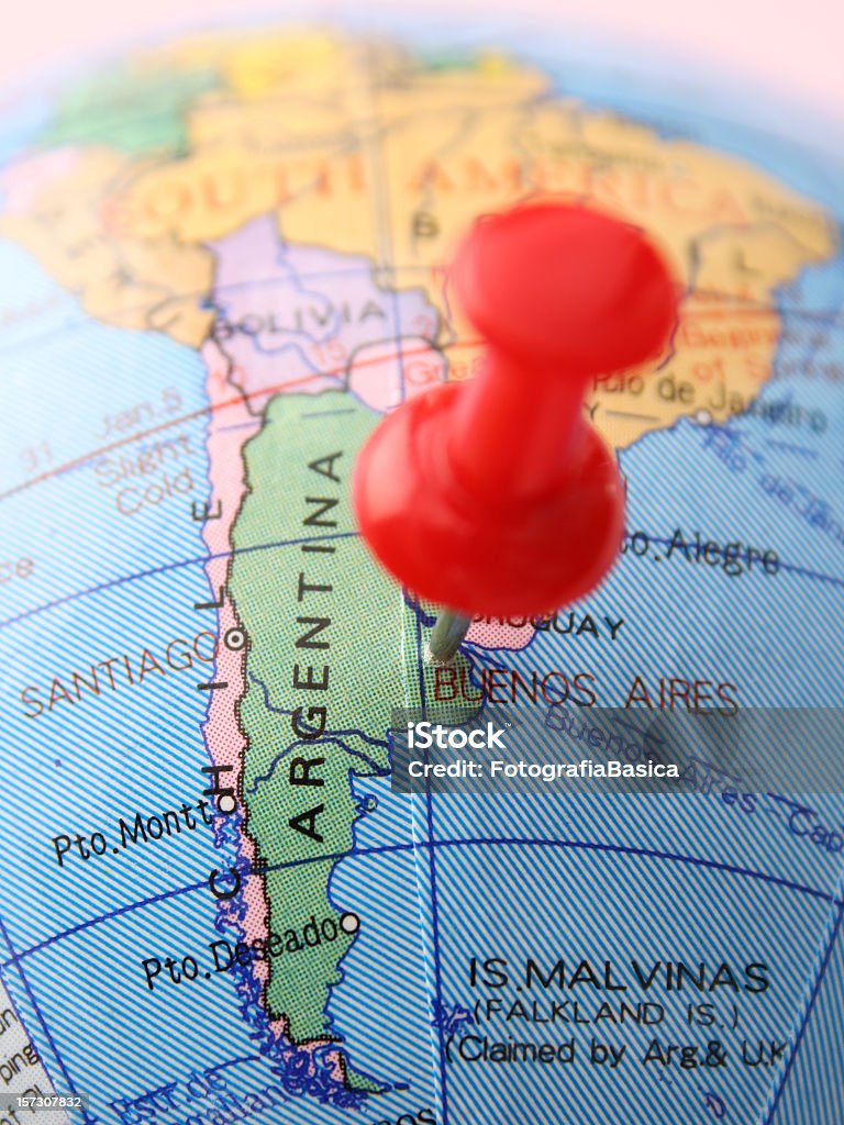 Argentina Pushpin pointing Buenos Aires in cheap plastic globe. Shallow depth of field Map Stock Photo