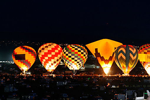 Landing of large air balloon on green field