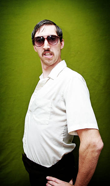 Dancing Mustache 70's Guy With Sunglasses An ugly man with a mustache poses in front of a green background.  Vertical.   comb over stock pictures, royalty-free photos & images