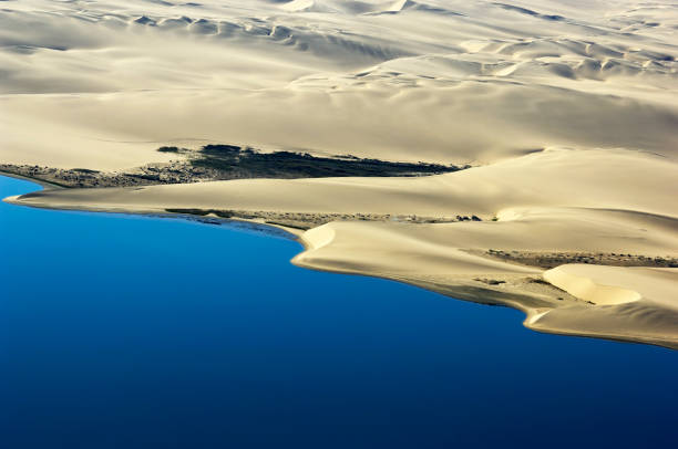 Namibia Desert Gravel road through the dry, grey and surreal Moon Landscape, Moonscape Canyon - Kuiseb. Aerial Drone View. Moon Landscape, Swakopmund, Erongo Region, Namibia, Southern Africa, Africa.