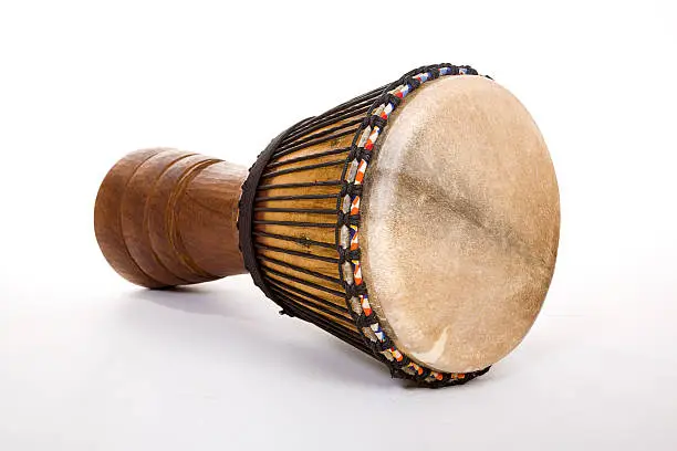 An African made Djembe drum on a white background.