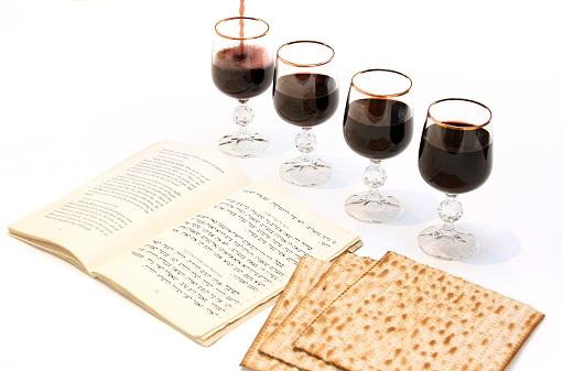 Passover matzo Jewish holiday celebration of matzah with cups red kosher wine served during kiddush