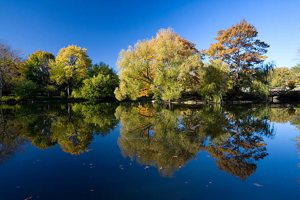 Springfield, Massachusetts, USA - October 26, 2015: Basketball Hall of fame reflecting on the Connecticut River during the autumn foliage season