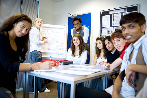 istock further education: bright smiles from a diverse group of classmates 157308695