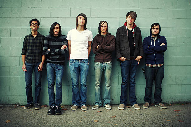 istock Group of Six Men on a Green Brick Wall 157308921