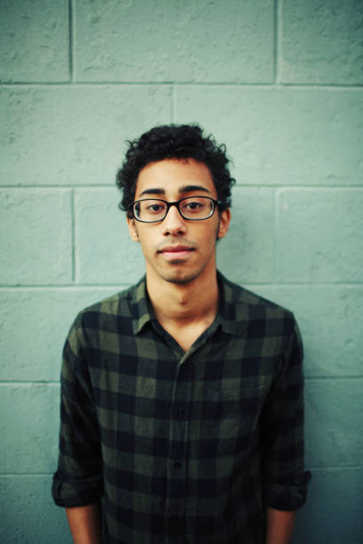 istock Young Black Man with Glasses on Green Brick Wall 157308928