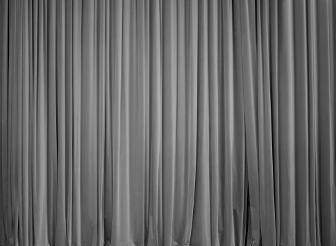 Stage curtain. Color it in your favorite color. Add vignetting to get spotlight. Add your copy on it (lot of space;))! 