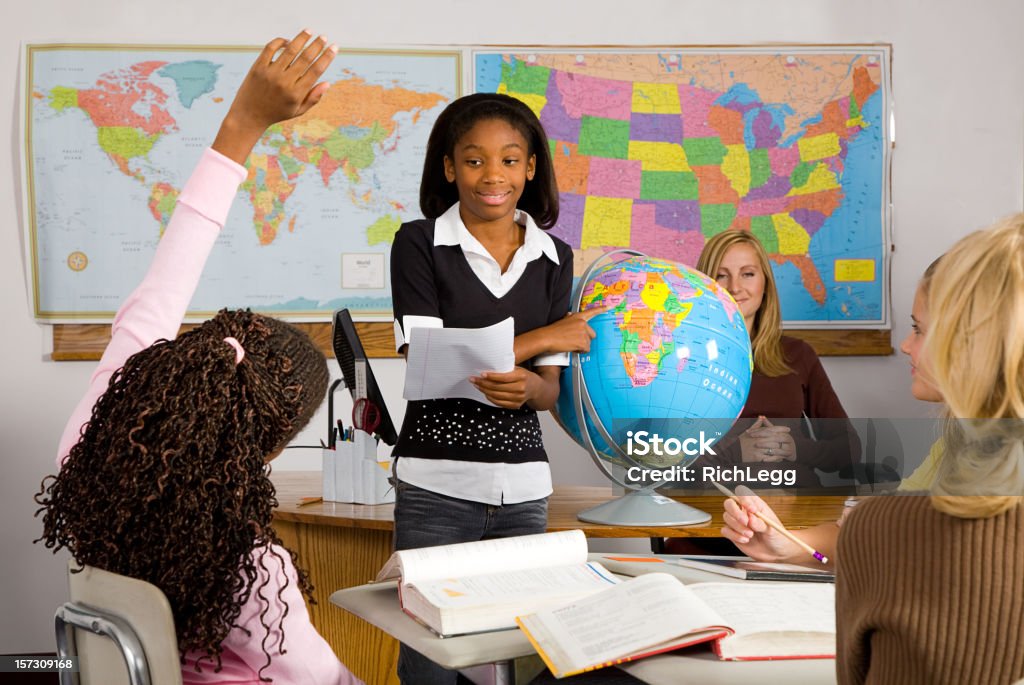 Classroom Series A student giving a report in front of a classroom. Child Stock Photo