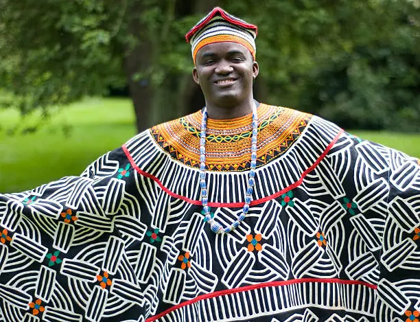 A Cameroonian man wearing traditional African clothing.