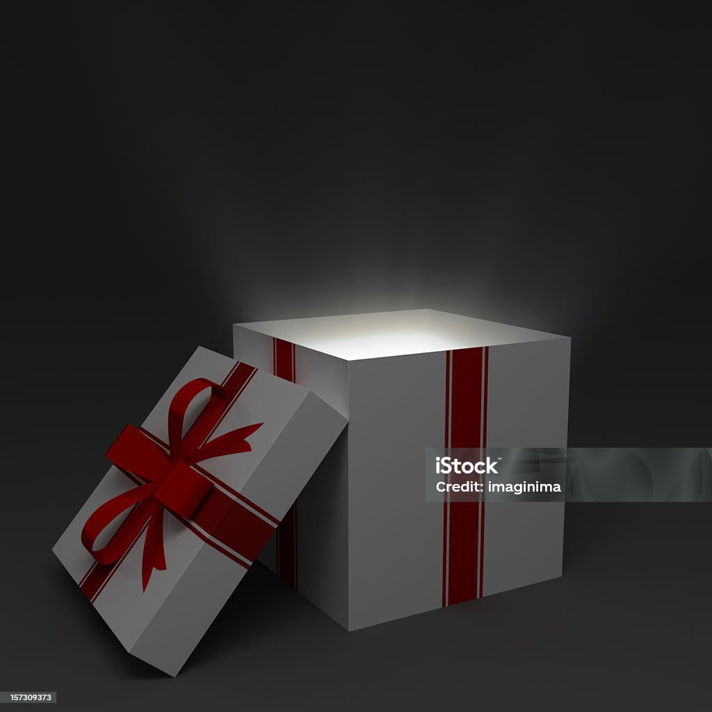 Surprise... Opened gift box with light. Mystery Stock Photo