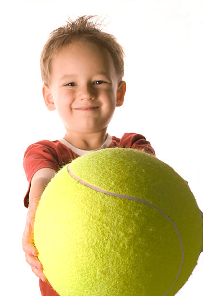 istock Boy with tennis ball 157309397