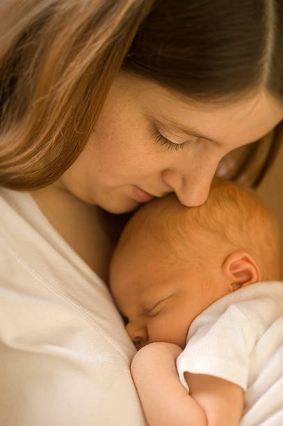 istock Mother and sleeping baby boy 157309402