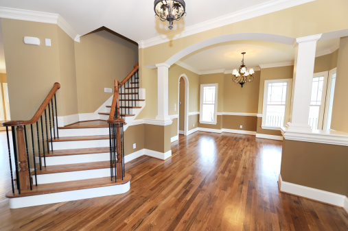 Home interior with hardwood floors and stairs.