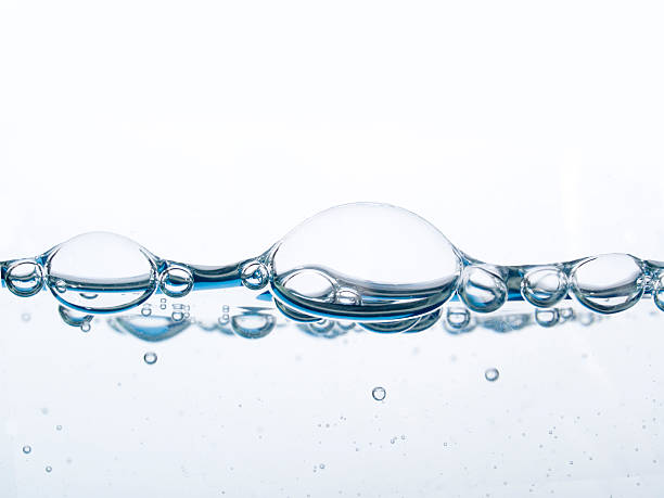 istock Close-up of bubbles on water isolated on white 157309619