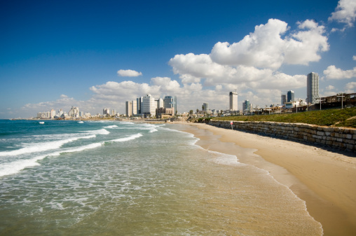 Tel-Aviv Israel coastline with skyscrapers and hotels on a sandy beach