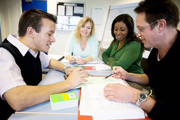 istock adult education: mature students working together in the classroom 157309755