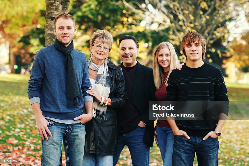 Happy Family in Jeans Together at a Park  Adult Stock Photo