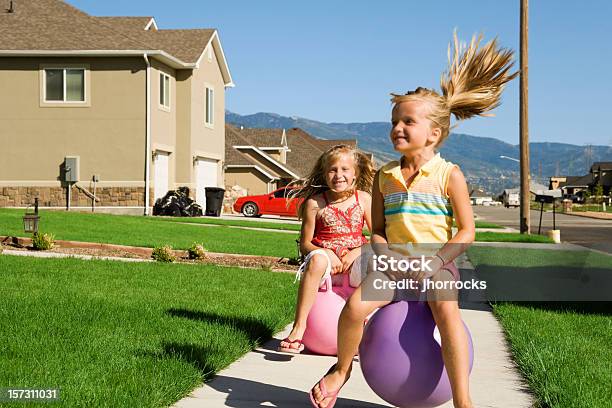 Bouncy Summertime Fun Stock Photo - Download Image Now - Blond Hair, Blue, Blurred Motion