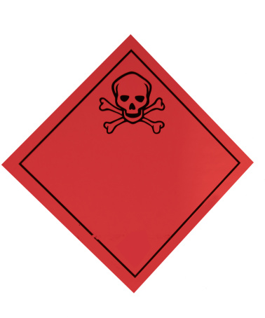 A skull and crossbones on a red label indicating poisonous or dangerous goods.