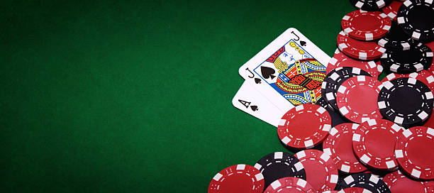 Blackjack table and pile of chips on right side of image stock photo
