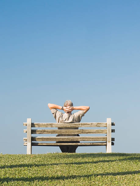 Man on Bench Series stock photo