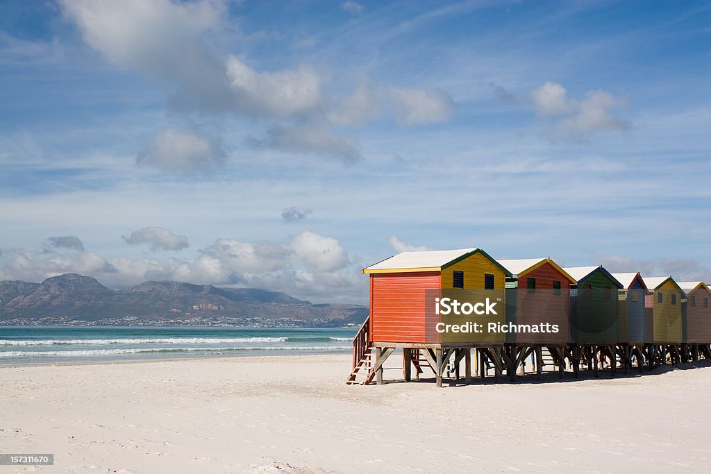 Colourful Cabins on Empty Beach Cabins on the white sands of Muizenberg beach in Cape Town, South Africa. Beach Stock Photo