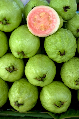 Pile of fresh and juicy guavas at the local market in Asia