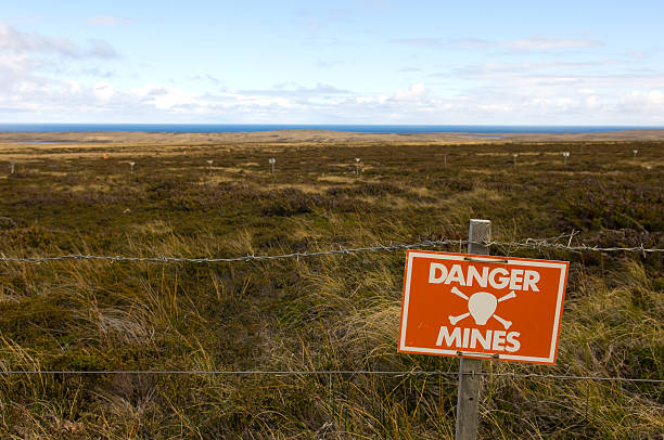 Danger Minefield with warning sign  land mine stock pictures, royalty-free photos & images