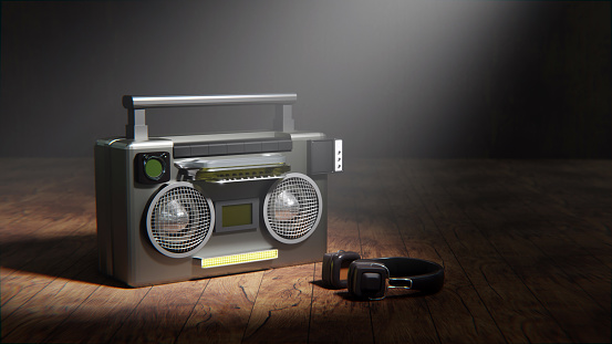 Macro focus boombox in 80s style with headphones on wood background from 3D render design.