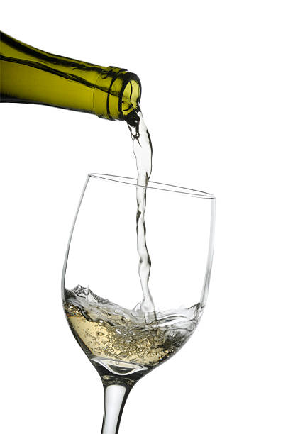 istock Pouring a glass of white wine w/clipping path 157312600
