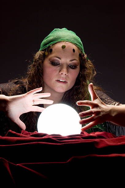 istock fortune teller with glowing crystal ball 157312672