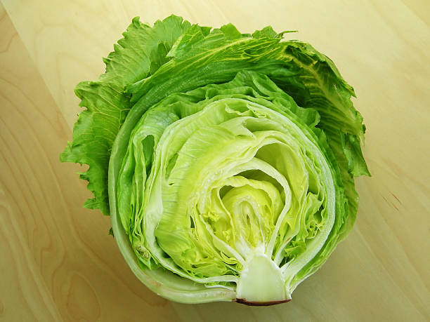 Iceberg lettuce on wooden table