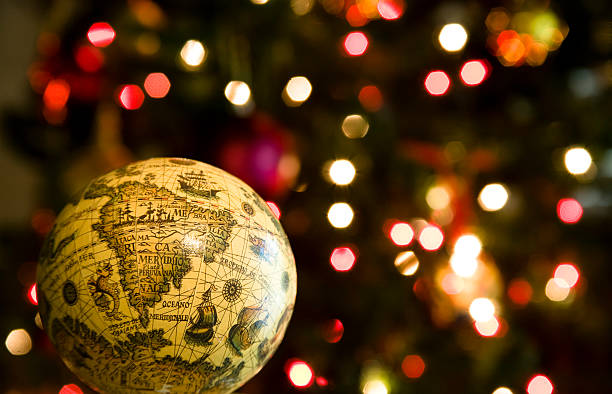 istock Christmas holiday. Tree, globe with twinkling colored lights background. Ornament. 157313063