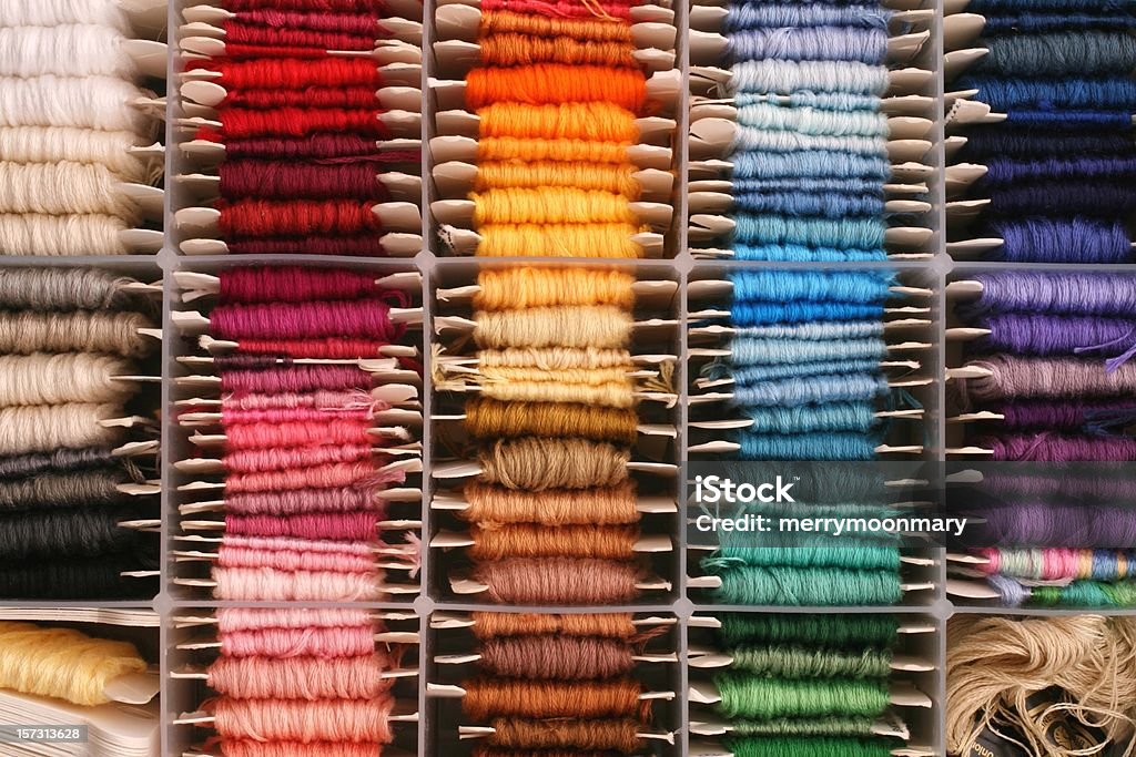 rainbow of embroidery thread a well organized collection of embroidery thread for articstic, color palette, or organized living background.  more like this Thread - Sewing Item Stock Photo