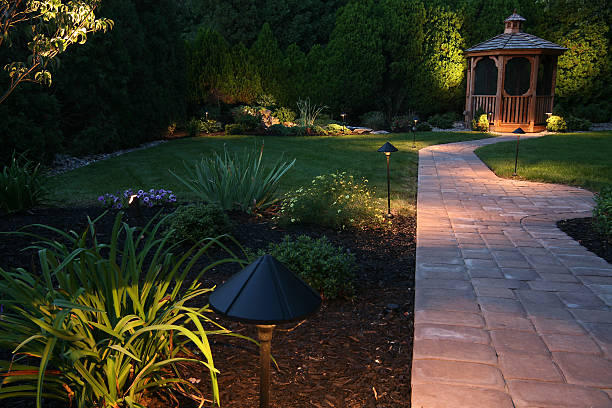 evening oasis dusk in the landscaped garden illuminated stock pictures, royalty-free photos & images