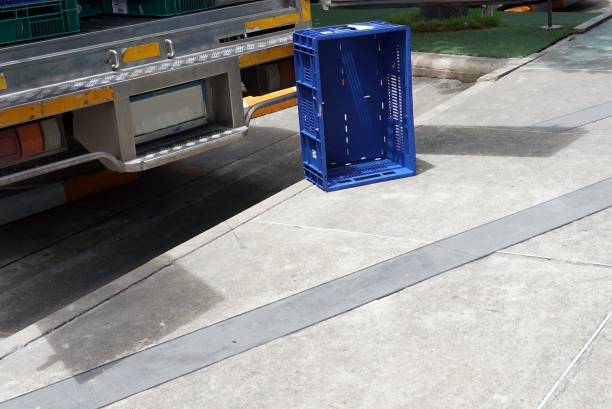 istock A blue plastic box for cargo transportation with a truck car in the warehouse. 1573136925