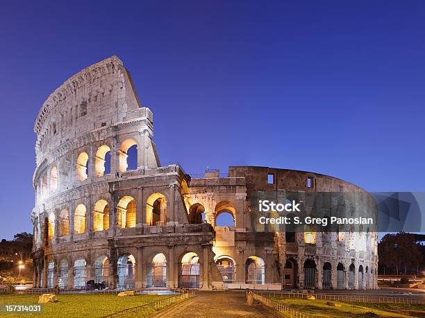 Photo Of The Coliseum In Rome Against Blue Sky Stock Photo - Download Image Now - Coliseum - Rome, Rome - Italy, Ancient Rome