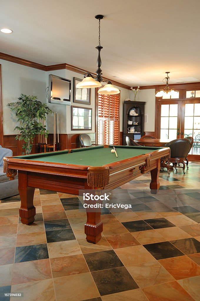 Basement Entertaining Incredible basement-game room area with hi-def tv and pool table. Arts Culture and Entertainment Stock Photo