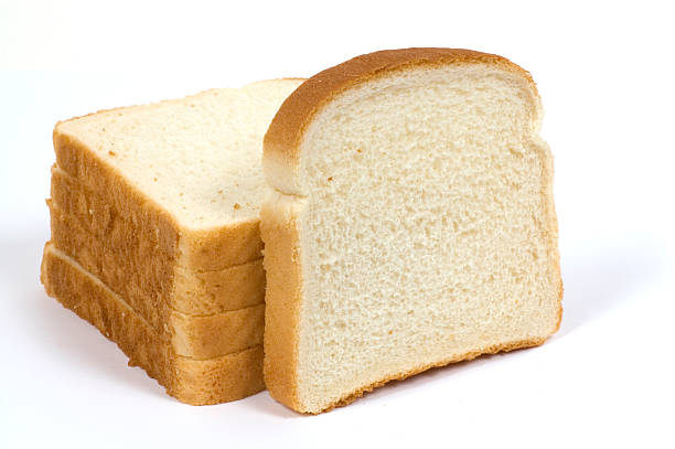 Stack of sliced white loaf of bread stock photo