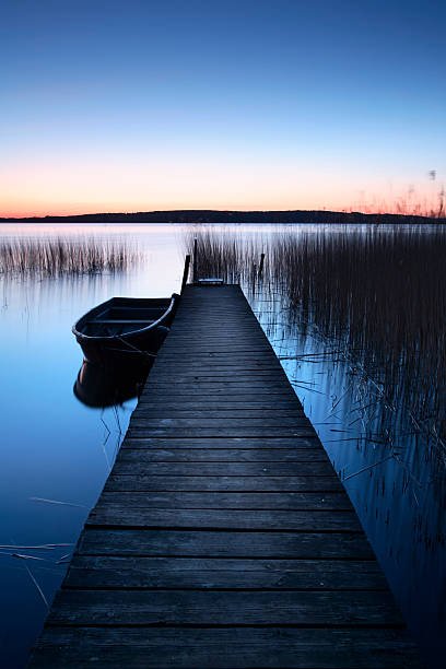 istock Jetty with Rowing Boat at Dawn 157314150