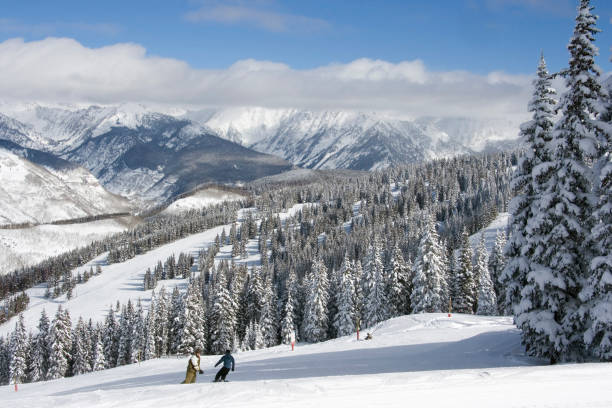 Frisco, Colorado Western Slope sunrise on snow capped rocky mountains of Gore Range ski resort slope winter snow making mist